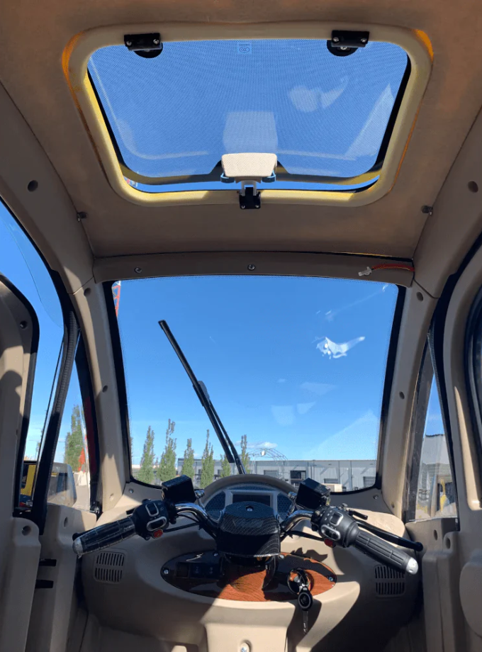 GIO GOLF ENCLOSED MOBILITY SCOOTER 60V 1200W, top speed 18mph, Range up to 30 miles, backup camera, heater, fan, alarm, media center, 500lb load capacity